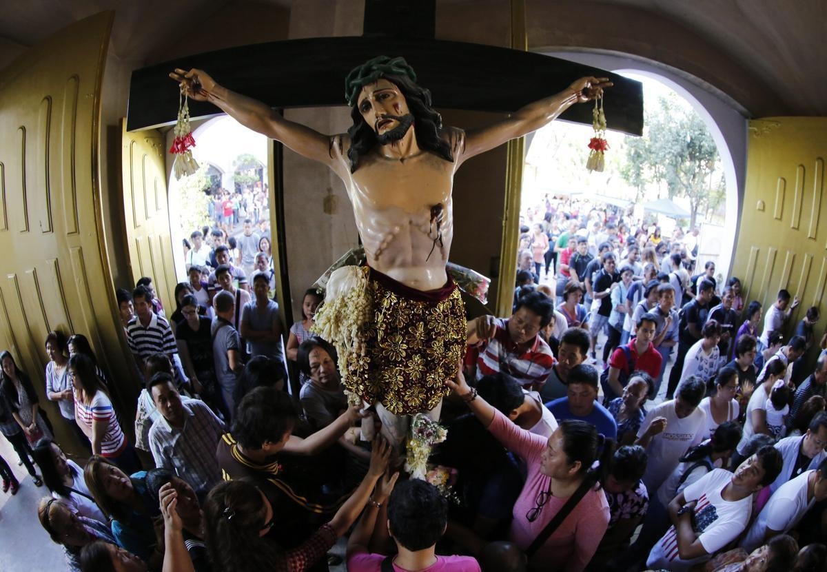 Filipinos attend a Holy Mass at a church in Baclaran, a neighborhood district located south of Manila, for Ash Wednesday. The cross markings on their forehead signify the start of Lent.