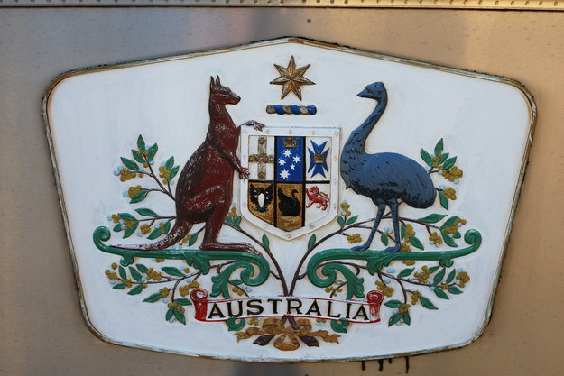 The coat of arms features both emu and kangaroo, because neither of them can walk backwards.