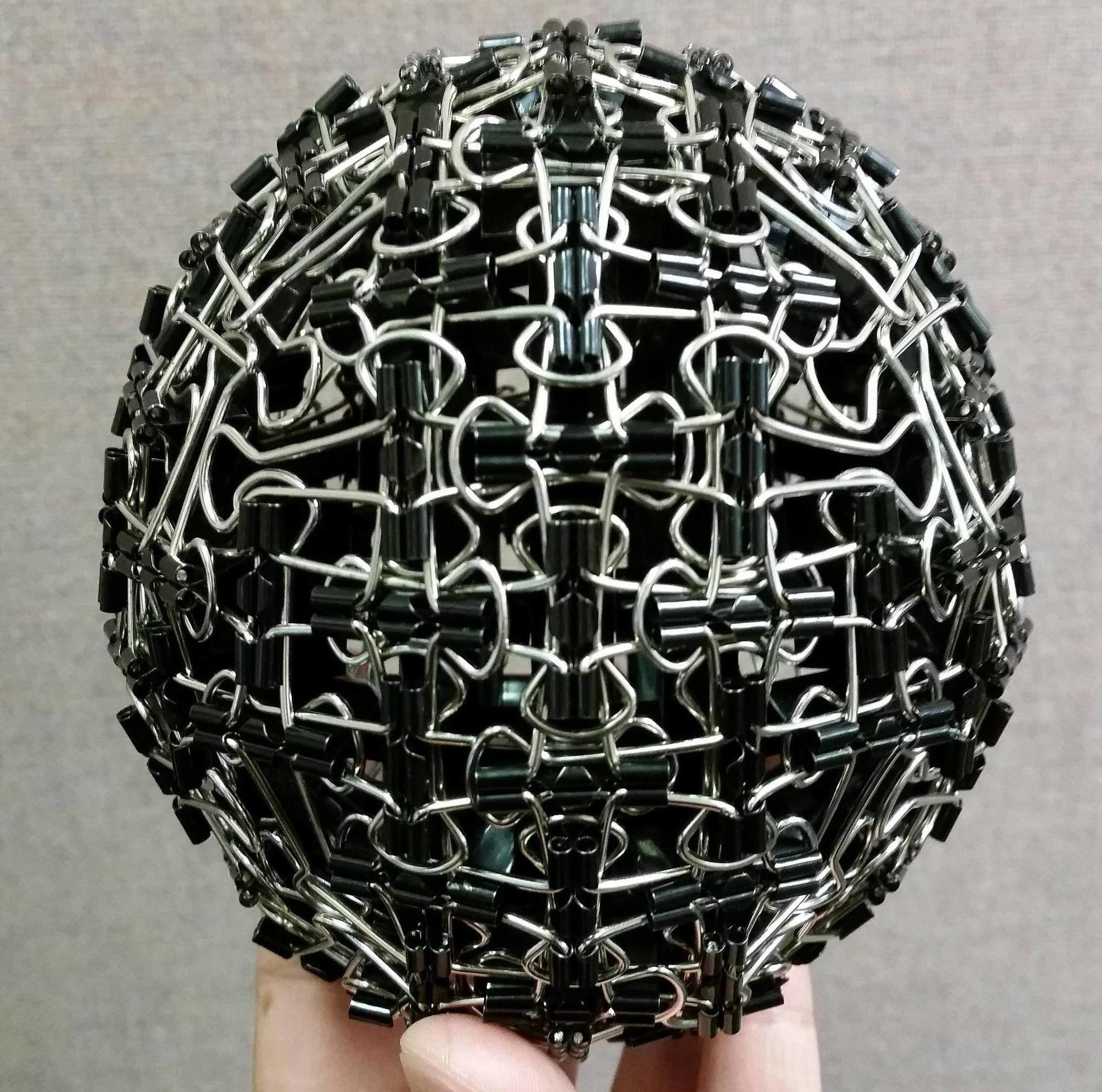 A ball made out of binder clips.