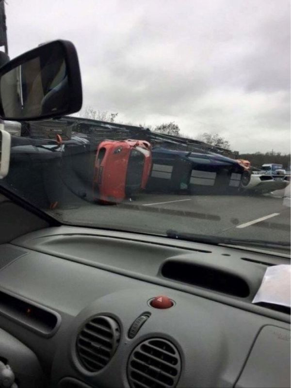 truck carrying supercars crashes