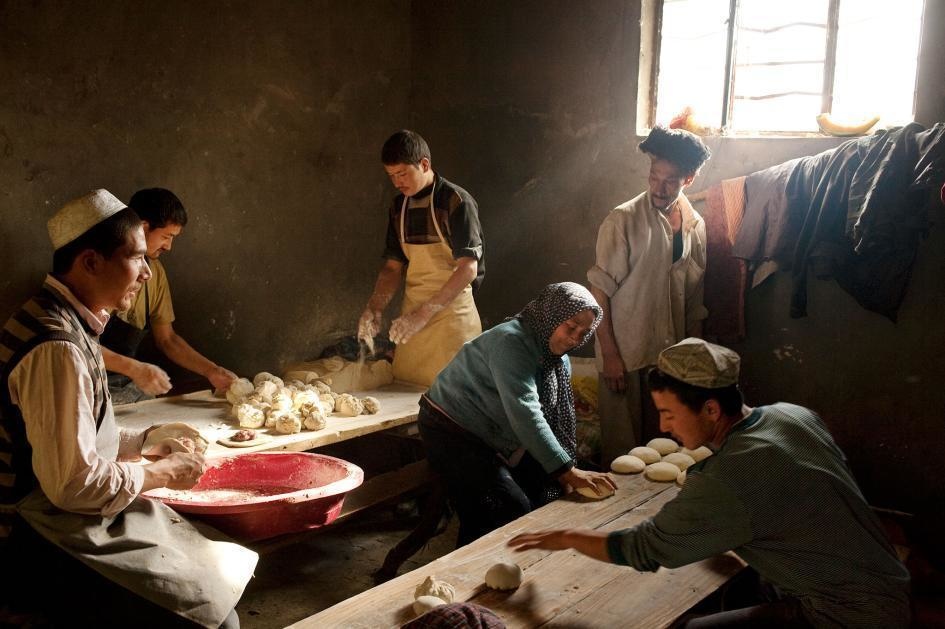 A Muslim ethnic minority, or Uyghurs, make mutton pies in a restaurant kitchen in Xinjiang, China.