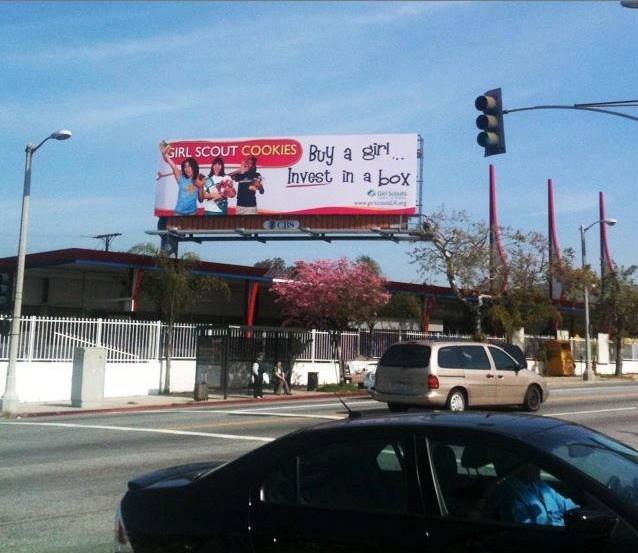 billboard - Girl Scout Cookies Buy a girl.. Invest in a box Na