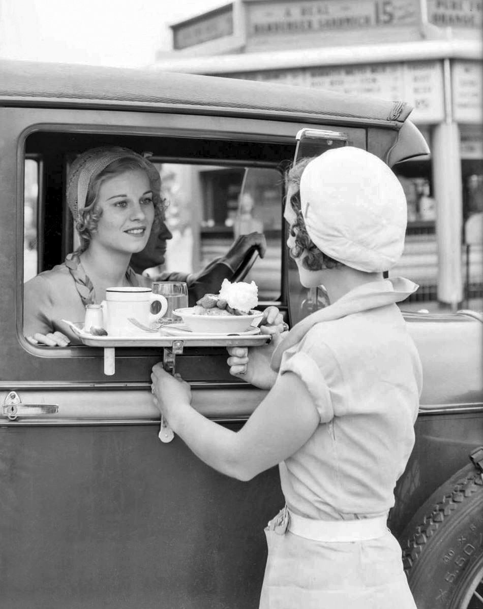 1932: A woman receives drive-up service at Carpenter’s Sandwiches, Sunset and Vine in Los Angeles.