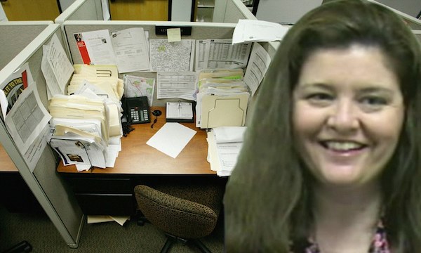 In February 2011, the body of Rebecca Wells was found slumped over her desk and could have been there for up to 24 hours. 

Wells, 51, a compliance auditor for the LA County Internal Services Department (ISD), died while working in her cubicle. She was was sitting in a line of cubicles that were unoccupied with no phones or employees nearby and was discovered by a security guard the following afternoon. She is believed to have died of natural causes.