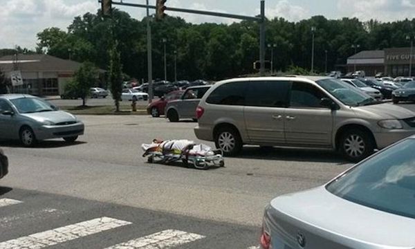 A body on a gurney fell out of a coroner's van when a door malfunctioned, sending the corpse into the middle of a busy roadway in Pennsylvania in July 2014. 

A photo on the Bucks County Courier Times website showed the dead body, wrapped in what appears to be a white sheet, lying in the street as cars buzzed by. The driver realized immediately that the door had opened and retrieved the deceased within minutes.