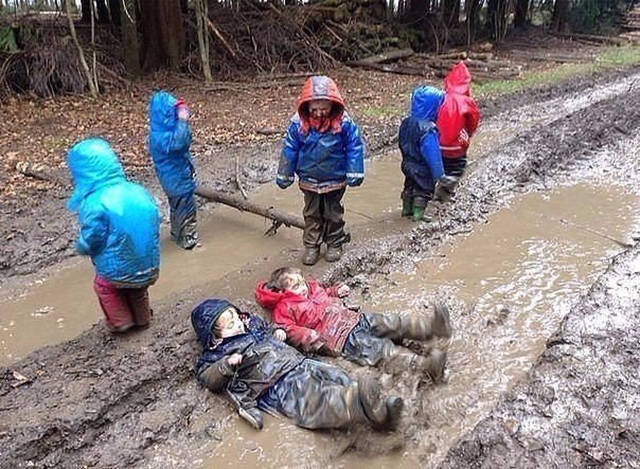 children playing in puddles