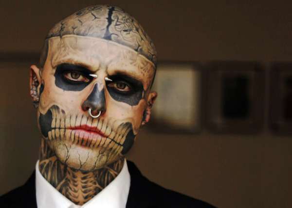 Rick "Zombie Boy" Genest shot to fame after displaying his macabre body art in Gaga's video for "Born This Way" in 2011. 

Genest, whose entire head and torso are covered, was discovered by Nicola Formichetti, Gaga's stylist, who quite literally plucked him from obscurity. Before fame, he was living on the streets of Montreal, doing everything from window-cleaning to performing as a circus freak to pay for his next tattoo.

He currently works as a male model appearing on runways and in fashion magazines worldwide.