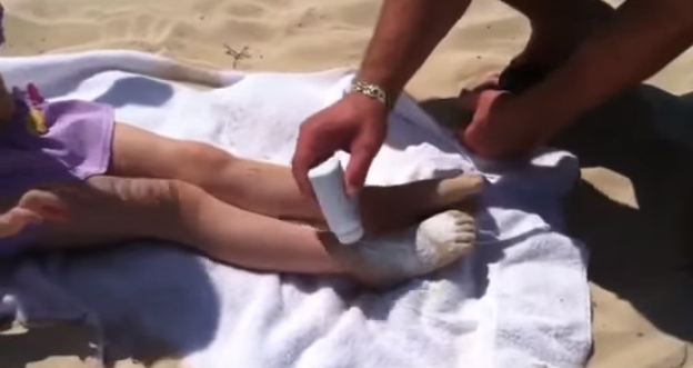 Keep baby powder in your car when you go to the beach. It makes the sand fall right off when you put some in your hand and rub it on the covered areas. Moisture is what makes sand stick to you.