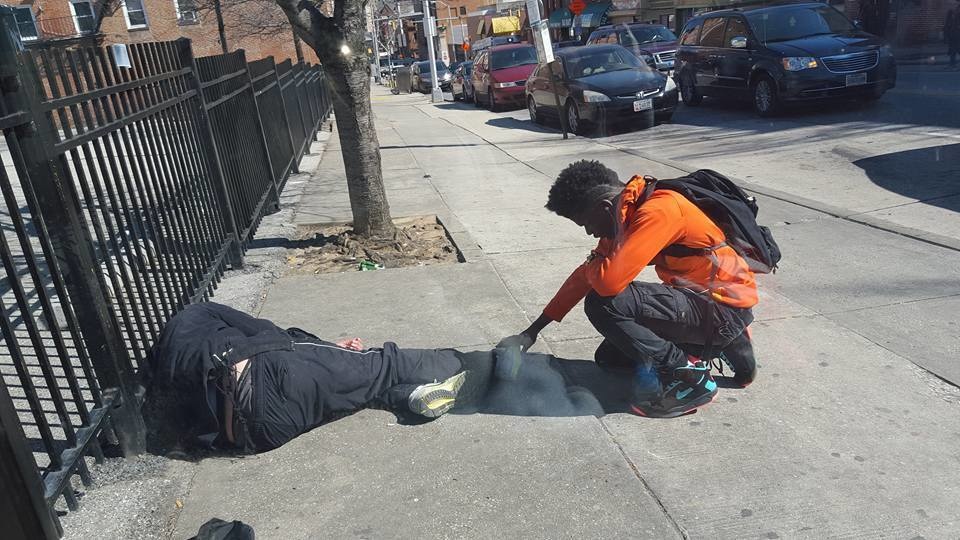 This young man stopped dead in his tracks to pray for a homeless man.