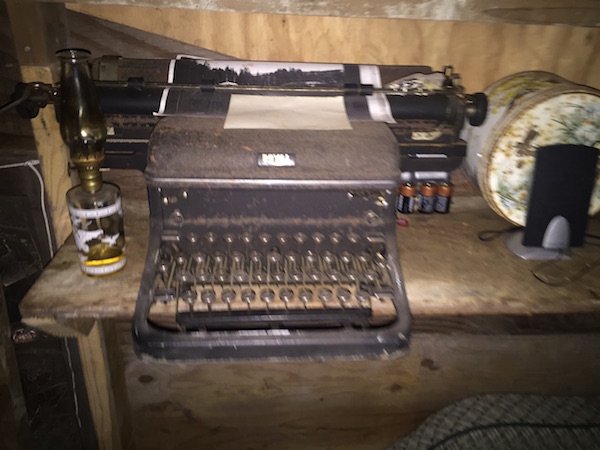 A small desk was set up in the center with a typewriter.