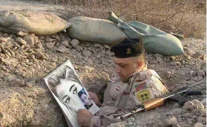 Iraqi soldier sketching a photo of his fiancé while on the front lines against ISIS