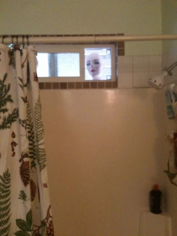 Place a mannequin head at your bathroom's window.