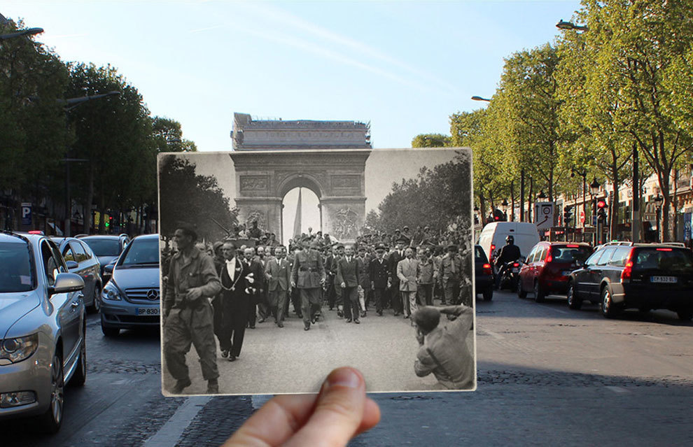 President De Gaulle on the Champ Elysees, the Arc De Triomphe standing tall in the background.