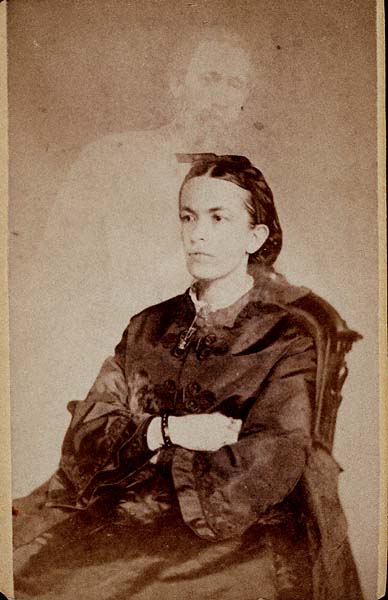 William H. Mumler was an American spirit photographer who worked mainly in New York and Boston. Perhaps his two most famous works are the photograph of Mary Todd Lincoln with the ghost of her dead husband Abraham Lincoln, and his photo of Master Herrod, a medium, with three spirit guides. After being accused of various activities, he was taken to court for fraud, with noted showman P. T. Barnum testifying against him. Though found not guilty, his career was over, and he died in poverty. Today, Mumler’s photos are considered fakes.