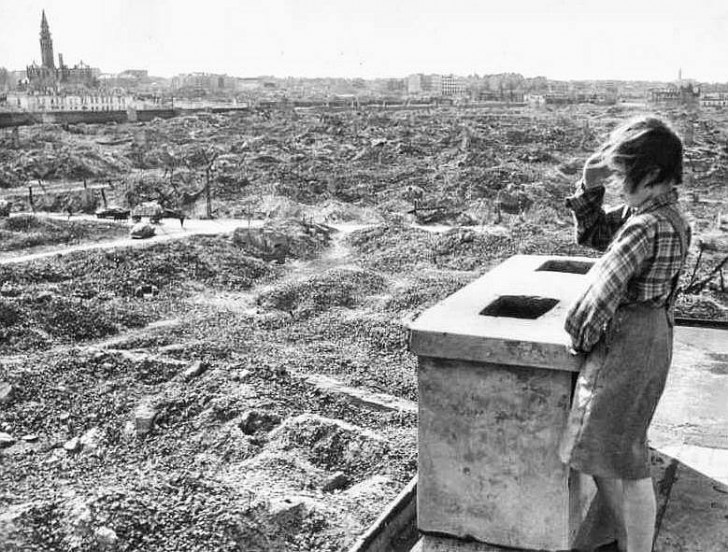 Girl looks out over the ruins of Warsaw, 1945. 

Warsaw was the most destroyed city in WWII. Manila was second. Not Berlin or Tokyo, or Hiroshima, experienced the same level of destruction as Warsaw.