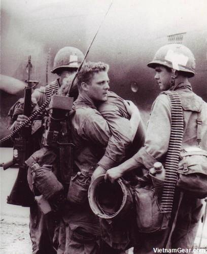 A radioman comforts his friend who just survived a battle during Operation Byrd in which nearly his entire platoon was wiped out Co. A, 2/7, 1st Cav. Div. (Airmobile) 1966.