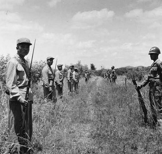 After the armistice agreement, North and South Korean soldiers stand guard at the 38th parallel, korea 1953