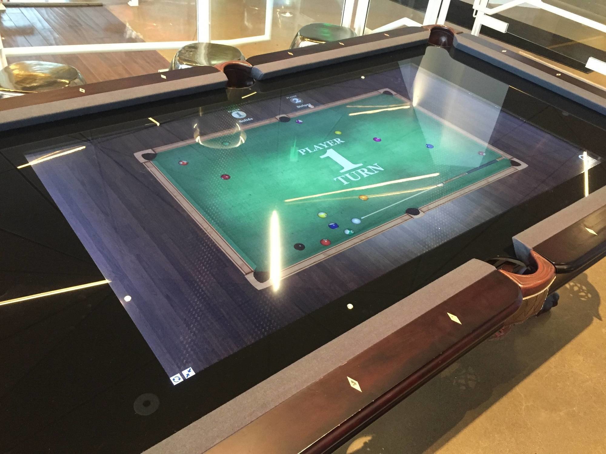 This pool table is actually a giant tablet with a pool app loaded onto it