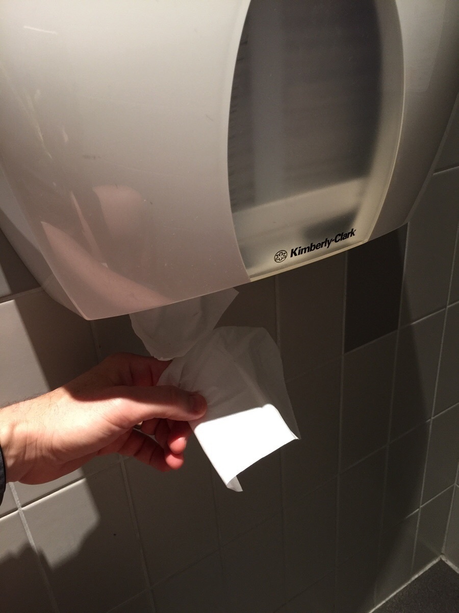 A machine that dispense individual sheets of toilet paper.