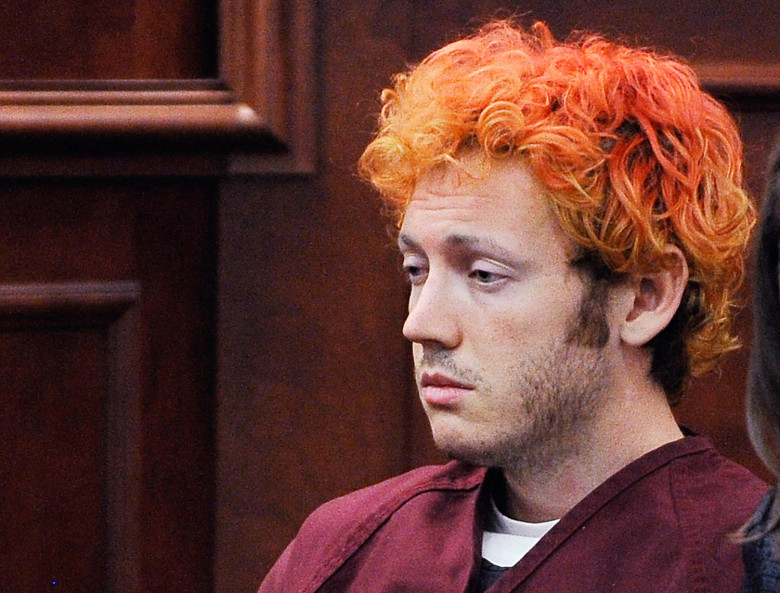 James Holmes. Holmes was convicted of killing 12 people and injuring 70 in a Colorado movie theater in 2012. He was sentenced to 12 life sentences plus 3,318 years.