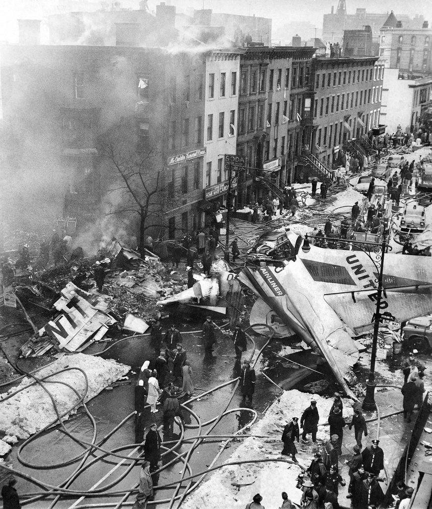The wreckage of an airplane, post-crash into a Brooklyn neighborhood in 1960.