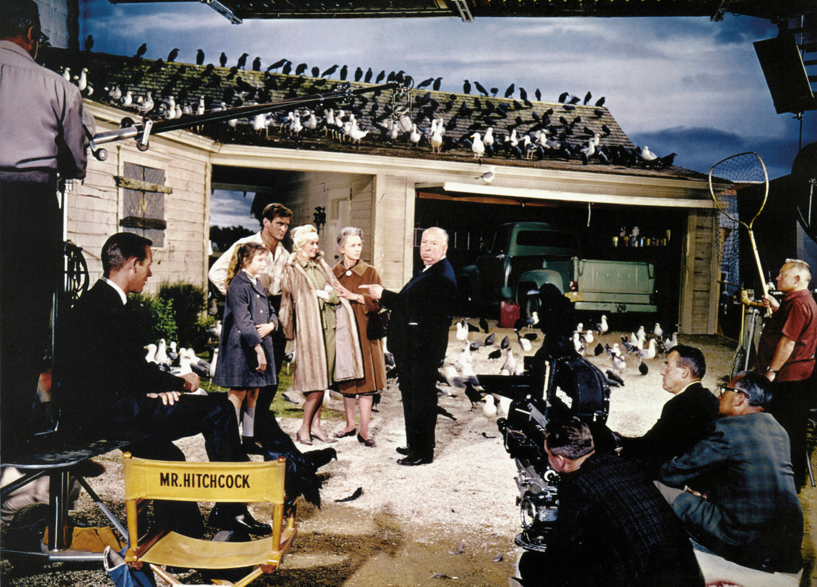 Director Alfred Hitchcock on the set of The Birds in 1963.