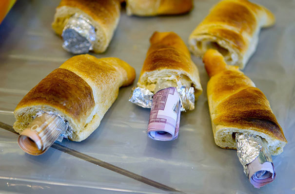 German customs officials found rolls of cash, hidden in pastries. In other words, some dough inside of some dough.