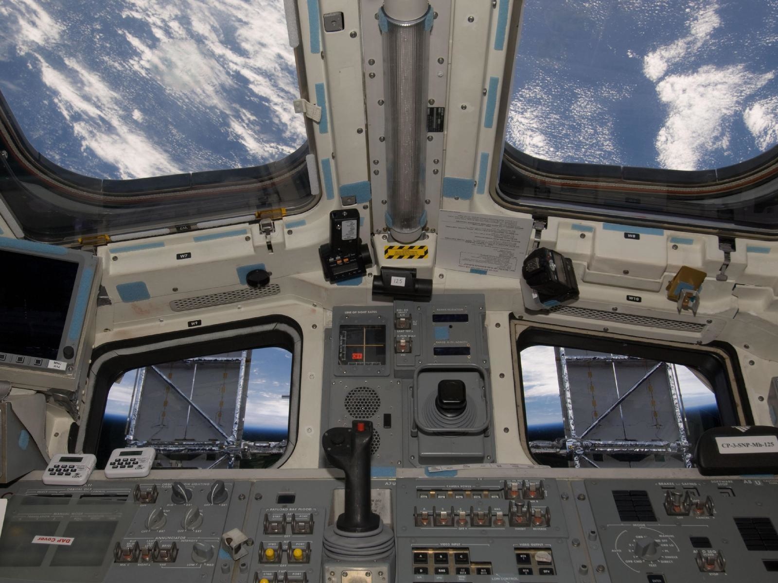 The solar panels of the Space Shuttle Atlantis provide a nice shade for the astronauts aboard.