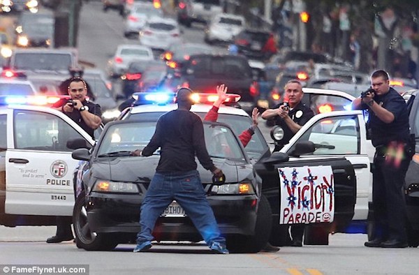 In 2015, a bizarre slow-speed chase ended peacefully when a pedestrian stepped into traffic forcing the driver to surrender.

A man in a Ford Mustang had a sign on the driver's side door that read "Victory Parade" as he led police on a ten mph pursuit in the western San Fernando Valley. He flashed victory signs and waved and saluted at bystanders on sidewalks as he wove in and out of traffic while police followed along Ventura Boulevard. 

The pursuit ended when an onlooker stepped into the path of the car. The driver came out with his hands up. He faces a misdemeanor charge of evading arrest. Police said he has a history of mental illness, and they believe he was having a "crisis."

The man who stopped the chase was detained by police, but later released.