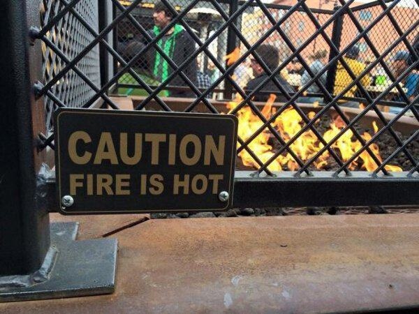 dumb signs - Caution Fire Is Hot,