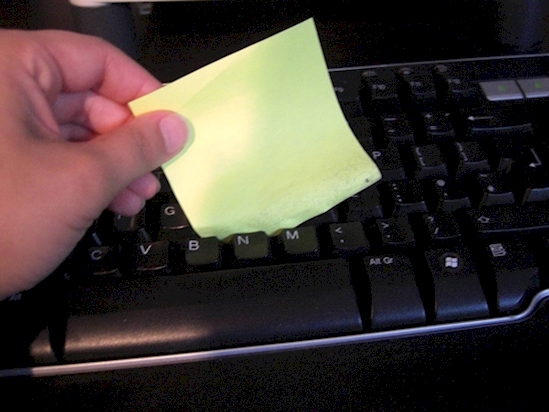 Can’t reach all the crumbs between your keys? A post-it note can.