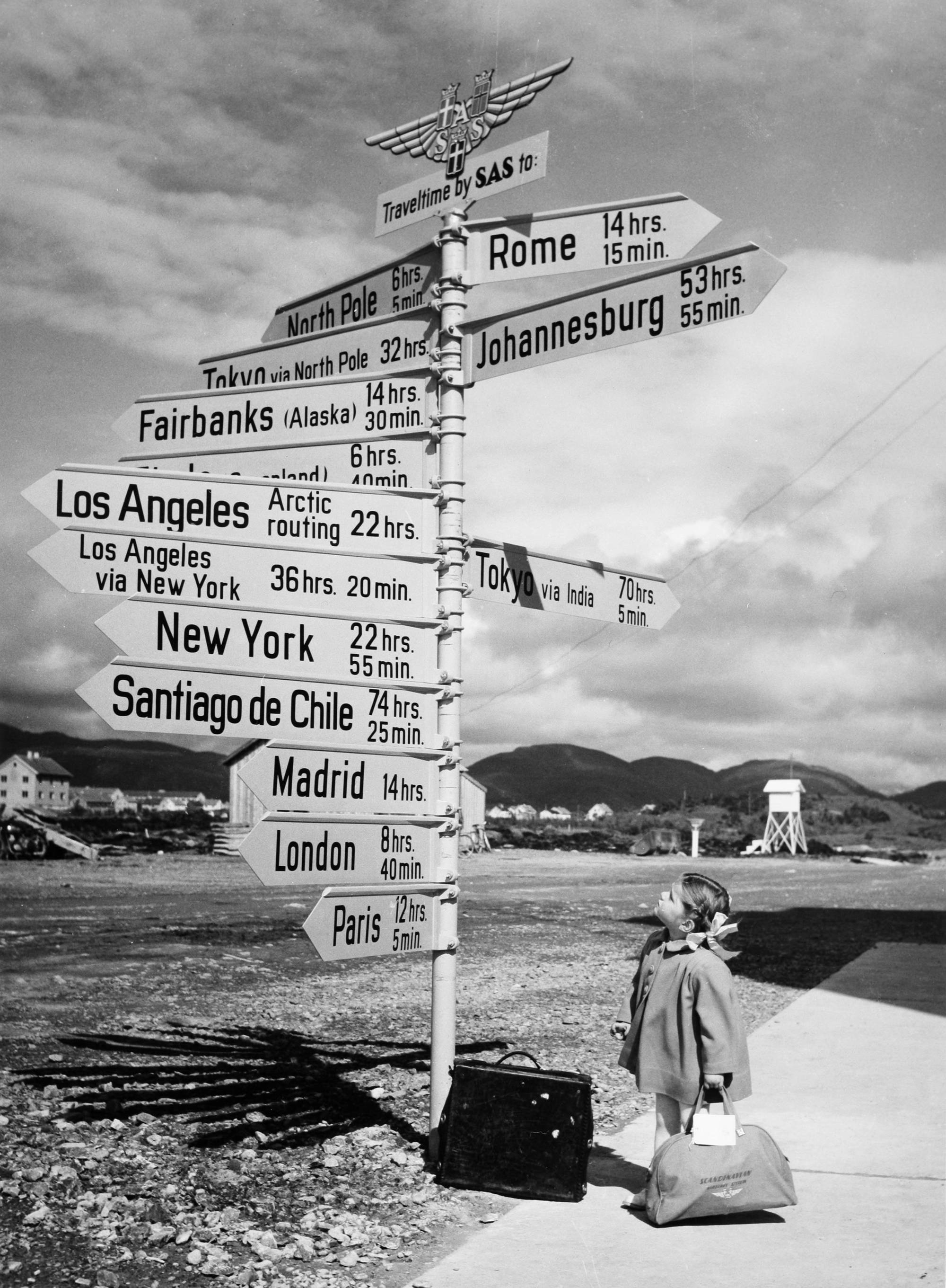 Little girl looking at signs at Bodö Airport, Norway in 1968.