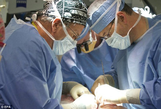 A team of 30 doctors and nurses tackled the surgery, spending over 14 hours transplanting a new face onto Hunter's.