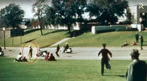 A mystery woman is caught taking photos of President John F. Kennedy after he was shot in Dallas, Texas on November 22, 1963. Neither her nor her photos were ever found.