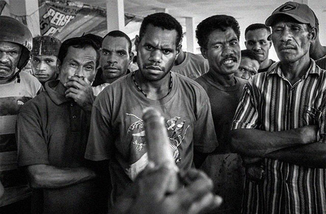 Demonstration of condom usage at a market in Papua