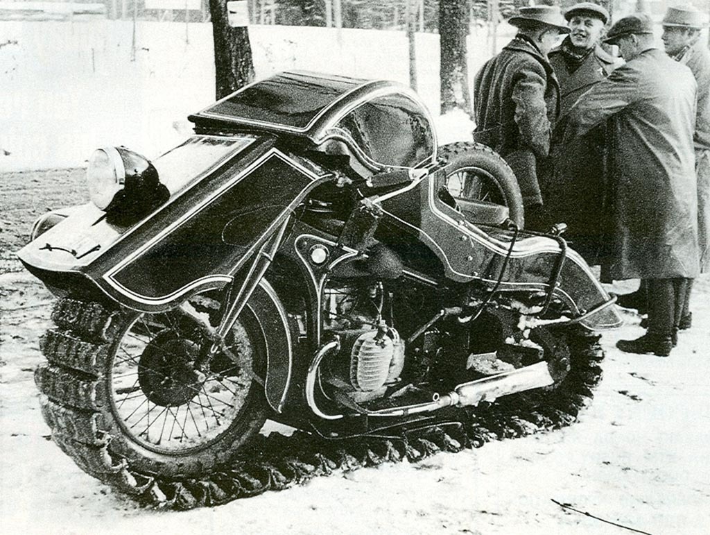 A 1936 BMW Schneekrad snow machine parked on the street.