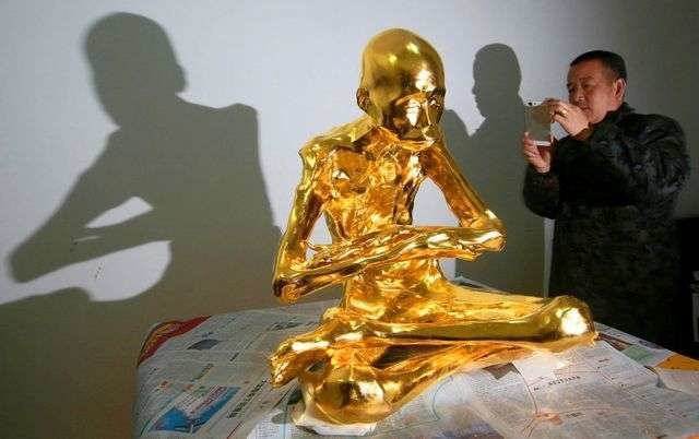 A Buddhist monk, his body preserved in gold.