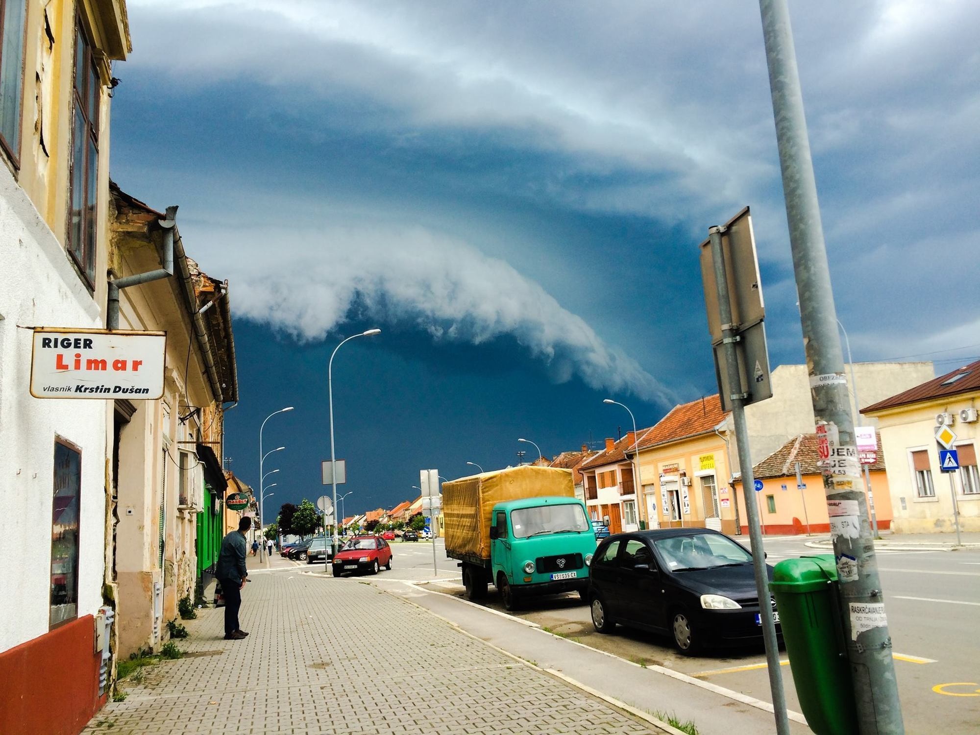 Cloud formation at the outskirts a city looks like a terrifying wave.