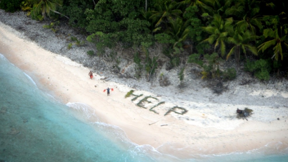 Photo of shipwrecked boaters found on desert island by U.S. Navy aircraft