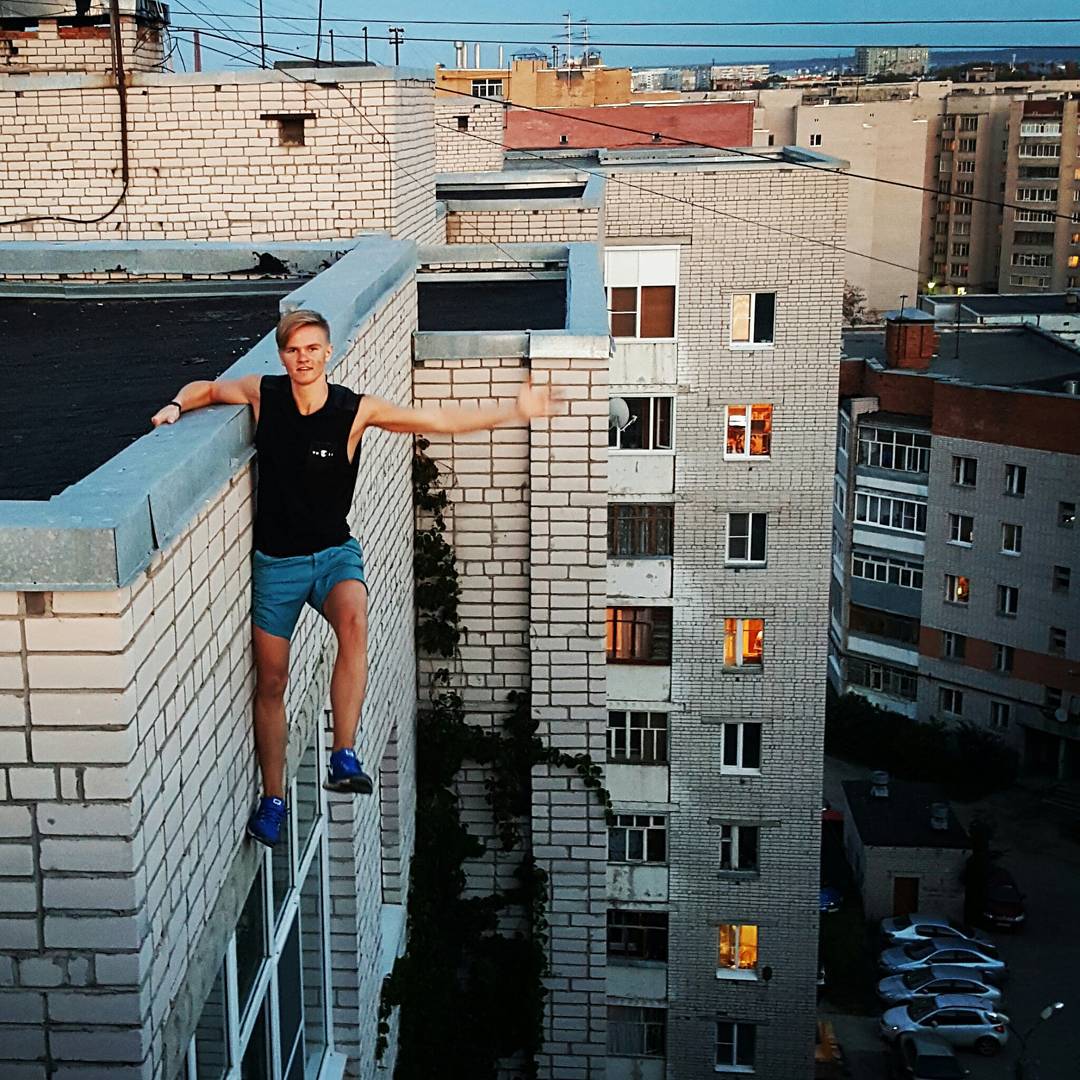 Russian teen seconds away from falling to his death.