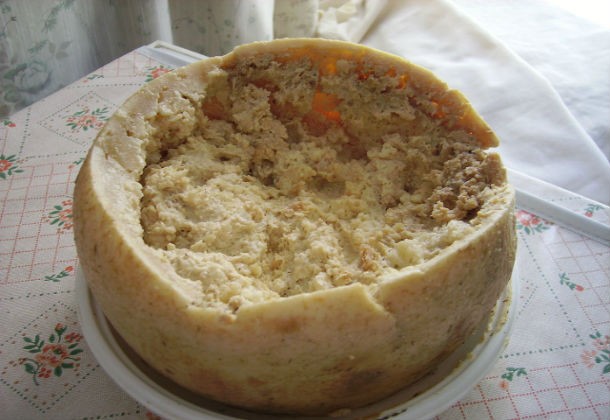 Casu marzu (rotten cheese) is a traditional sheep’s milk cheese the locals make in Sardinia, Italy. The cheese makers set the cheese outside and allow cheese flies to lay eggs inside it. The larvae break down the cheese’s fats and ferment it. Needless to say, it’s unnecessary to clear those white worms from the cheese before consuming it since this cheese is literally full of them.