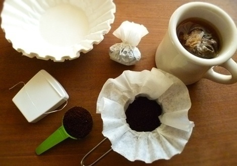 Create travel sized coffee bags.

Just put one scoop of coffee grounds into a coffee filter and then tie it up with dental floss.