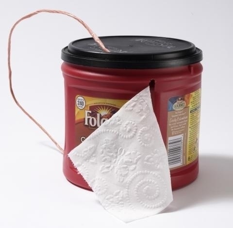 Put your toilet paper into a coffee can.

This will help not only hold your TP, but also protect it.