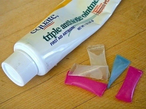 Create toothpaste single-use packets.

Just cut up straws and fill them up with the toothpaste. Use a lighter to seal up the ends once you're done.