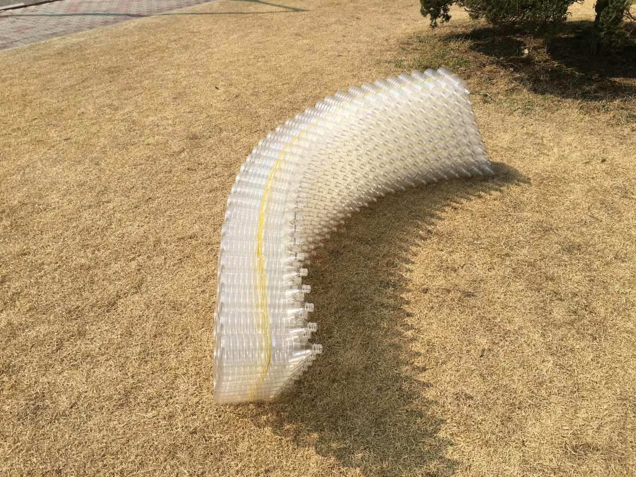 A wavy pile of plastic bottles.