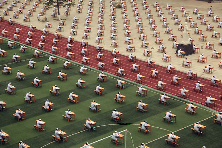 A group of Chinese nursing students in the middle of taking their graduation exam.