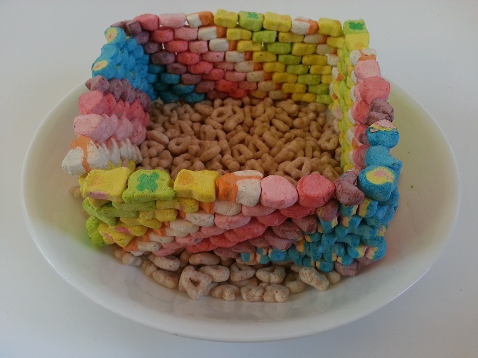 A wall of lucky charm marshmallows on top of the cereal.