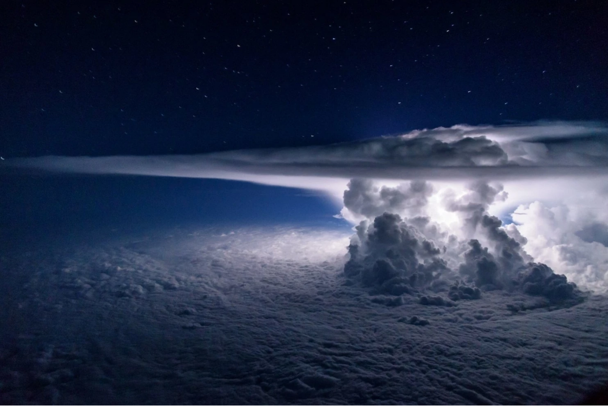 Thunderstorm at night over the Pacific ocean was taken at 37,000 feet by Santiago Borja