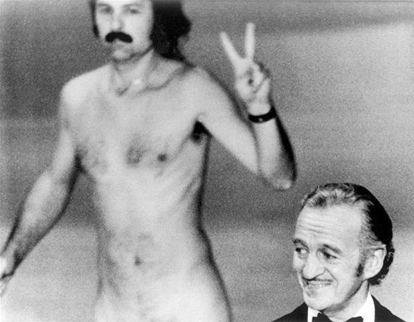 Streaker Robert Opel ran across the stage during the 1974 Academy Awards Show.

On April 2, 1974, host David Niven was getting ready to introduce Elizabeth Taylor to the stage when 33-year-old Robert Opel flashed a peace sign and his naked body on stage. How did the streaker get in? He reportedly used a press badge.

Sadly, Opel was murdered in 1979 during a robbery of "Fey-Way Studios," where he showcased gay male art.