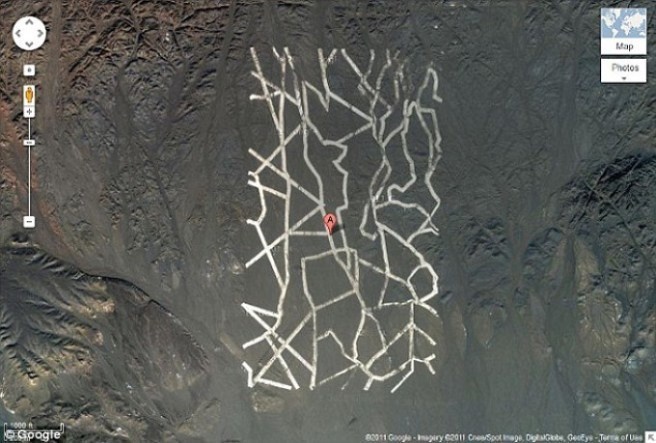 These rectangles, up to a mile long, can be seen from space near the Gansu province and Xinjiang, China.

We're not sure what's up, but someone should definitely check it out.